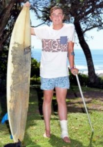 Jason stands by his board. Photo: Mark Andrews