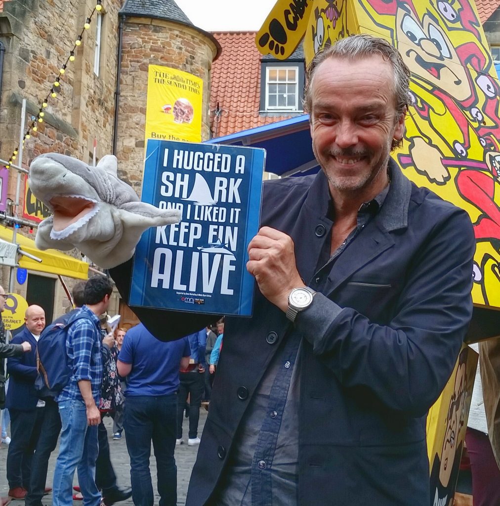 Actor John Hannah poses with Fin