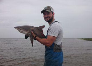 Marine Biologist Jonathan Davis with bull shark.