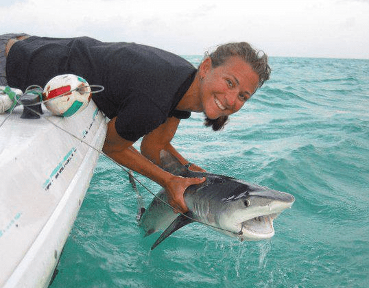 Dr. Kristine Stump with a juvenile Tiger Shark