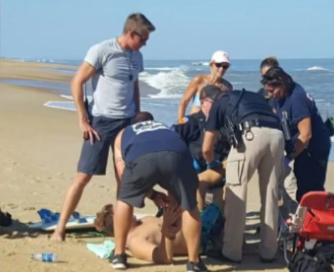 The unidentified surfer being treated. Photo: WVEC