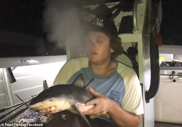 Man smokes bowl through baby shark